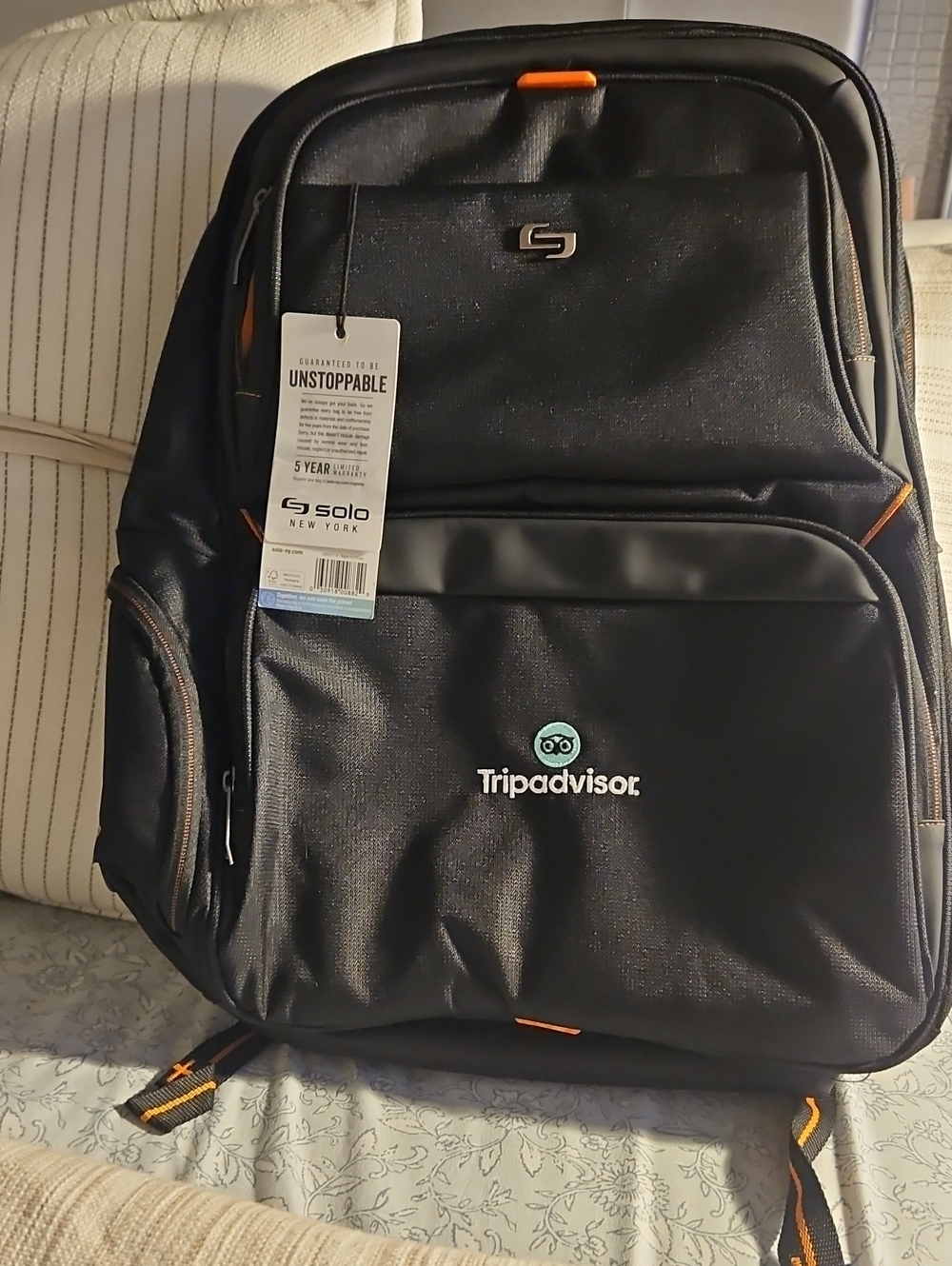 solo Black Backpack with Orange Accents - TripAdvisor Logo